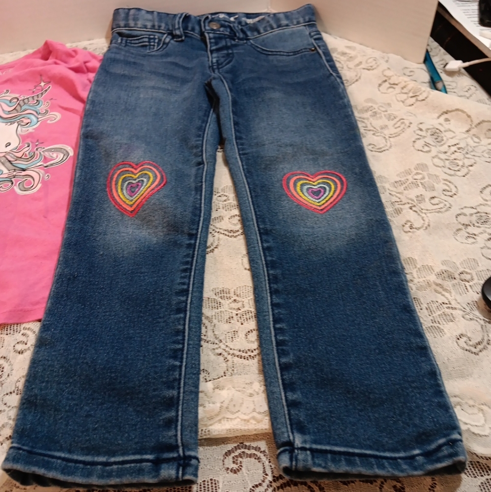 Cat and Jack blue jeans with heart patched knee pads.